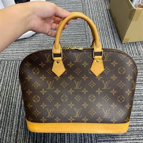 louis vuitton alma fake vs real|false louis vuitton alma bags.